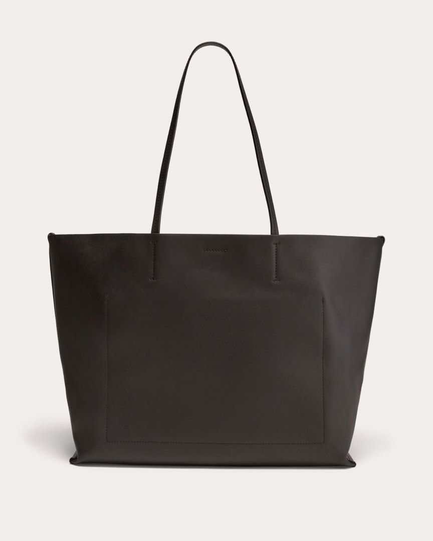Everlane Leather Tote (Category: Tote Bags) located in Quezon City. Submitted by teetharejade (Listing ID 1449226988, Image 2). Description: Everlane black leather tote Excellent condition, no flaws, soft leather Spacious interior - fits 15” laptop with a small pocket and snap closure. Minimalist design with a front pocket detail. Comfortable shoulder straps. Great for work or everyday use. No issue, with dustbag Description from website: Large a