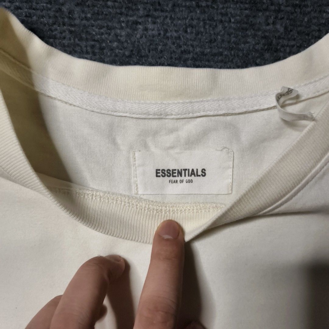 Fear of God Essentials T-Shirt Cream (Category: Tshirts & Polo Shirts ) located in Manila. Submitted by retro_d (Listing ID 1449317536, Image 3). Description: - Cream colored Fear of God Essentials t-shirt - Features the iconic Essentials logo on the chest - Bold graphic print on the back - Classic short sleeves and crew neck design - Comfortable and versatile for everyday styling.