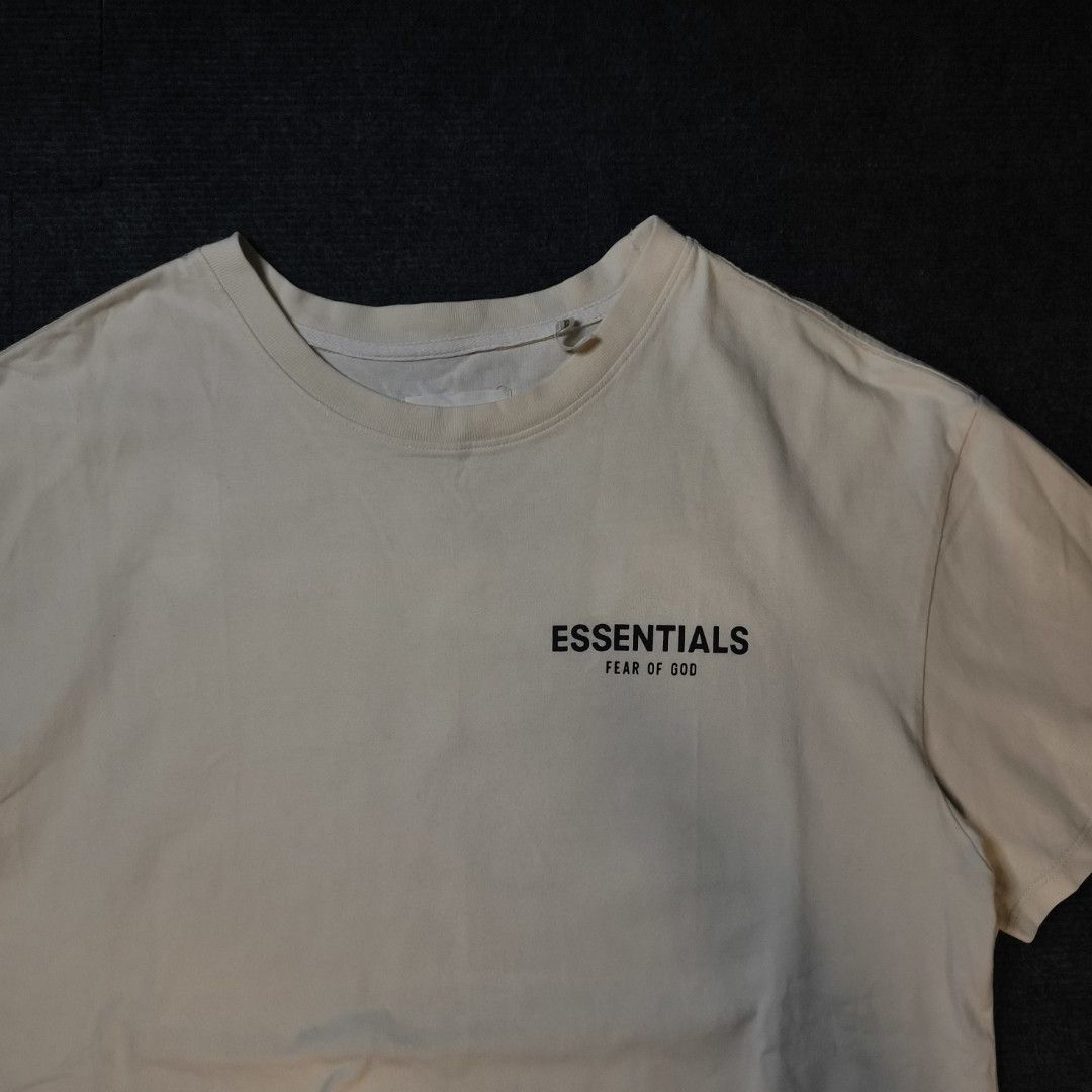 Fear of God Essentials T-Shirt Cream (Category: Tshirts & Polo Shirts ) located in Manila. Submitted by retro_d (Listing ID 1449317536, Image 2). Description: - Cream colored Fear of God Essentials t-shirt - Features the iconic Essentials logo on the chest - Bold graphic print on the back - Classic short sleeves and crew neck design - Comfortable and versatile for everyday styling.
