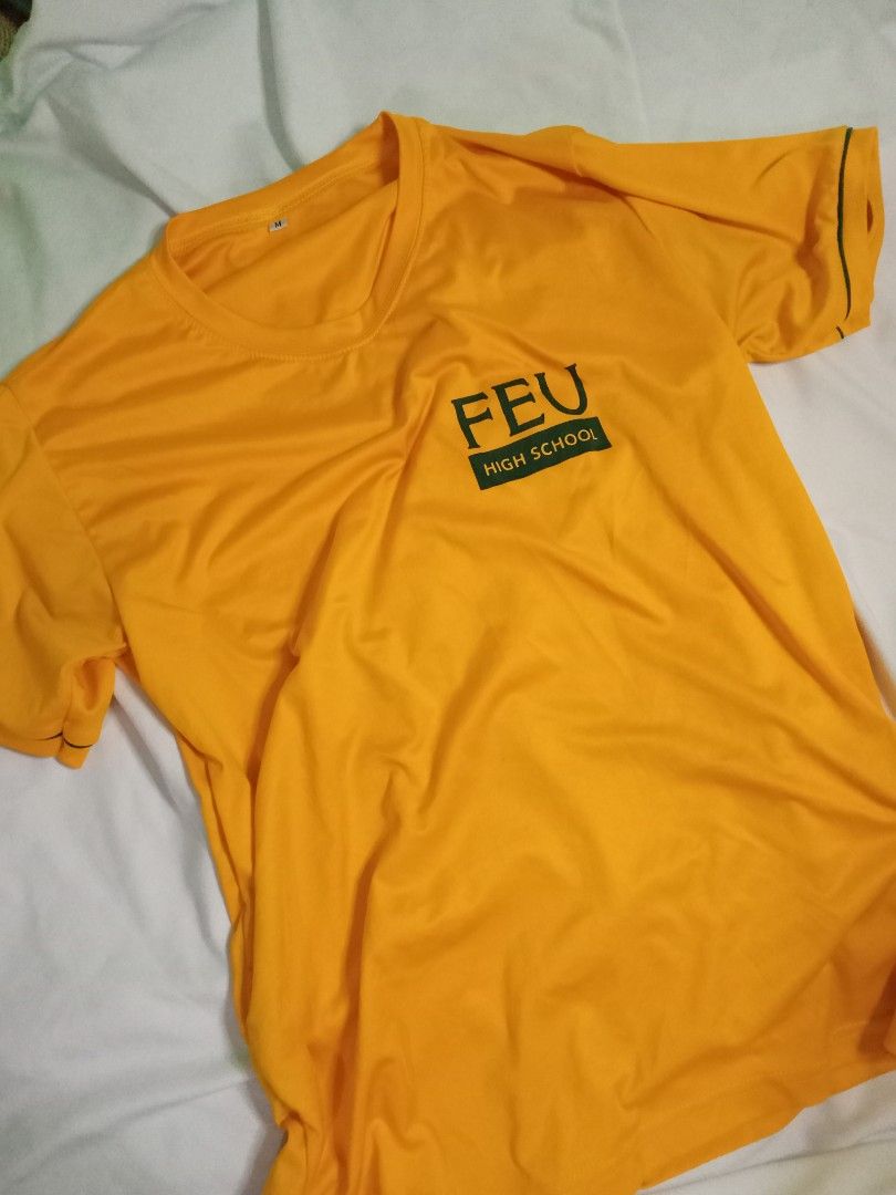 FEU Senior High School PE T-shirt (Category: Shirts) located in Manila. Submitted by fleurin (Listing ID 1449169465, Image 1). Description: - Yellow t-shirt with FEU High School logo - Size: Medium (M) - Short sleeves - Comfortable fabric - Ideal for school events or casual wear.