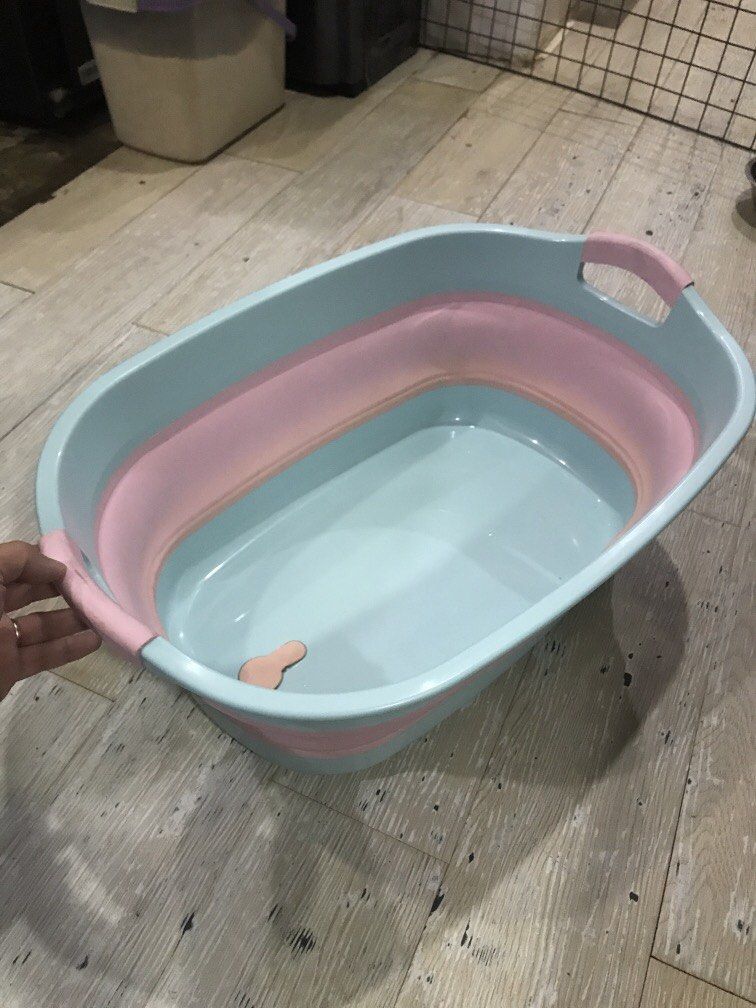 Folding Baby Bath Tub (Category: Bathtub & Bath Accessories) located in Carmona. Submitted by bihira (Listing ID 1449233636, Image 3). Description: Folding Baby Bath Tub - WYSIWYG - Baby blue and baby pink colors - Baby pink part, made of rubber - used condition.