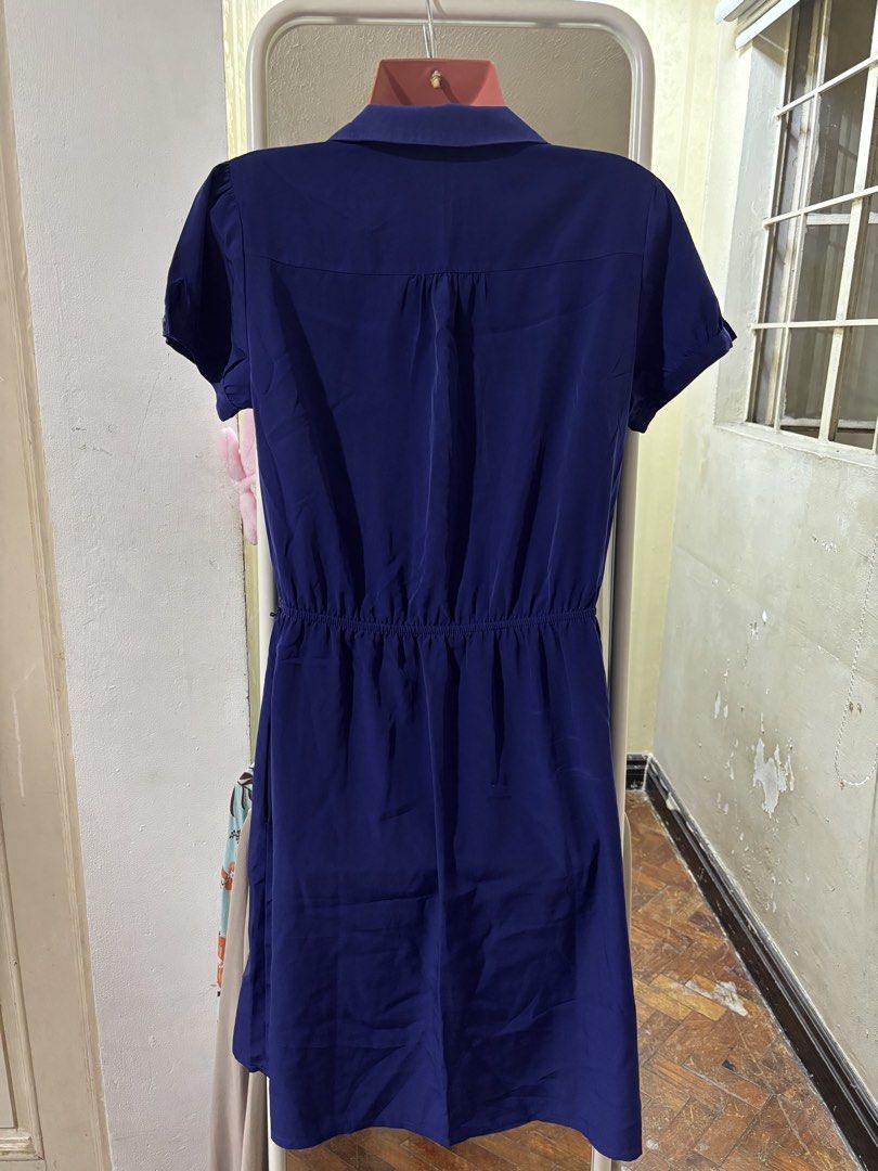 Forever 21 Essentials Royal Blue Button Down Shirt Dress (Category: Dresses) located in Bacoor. Submitted by shamraq (Listing ID 1449203030, Image 2). Description: - Royal blue shirt dress from Forever 21 Essentials - Short sleeves with button cuff details - Elasticated waist for a comfortable fit - Full button-down front - Convenient side pockets - Versatile for casual outings or dressing up.