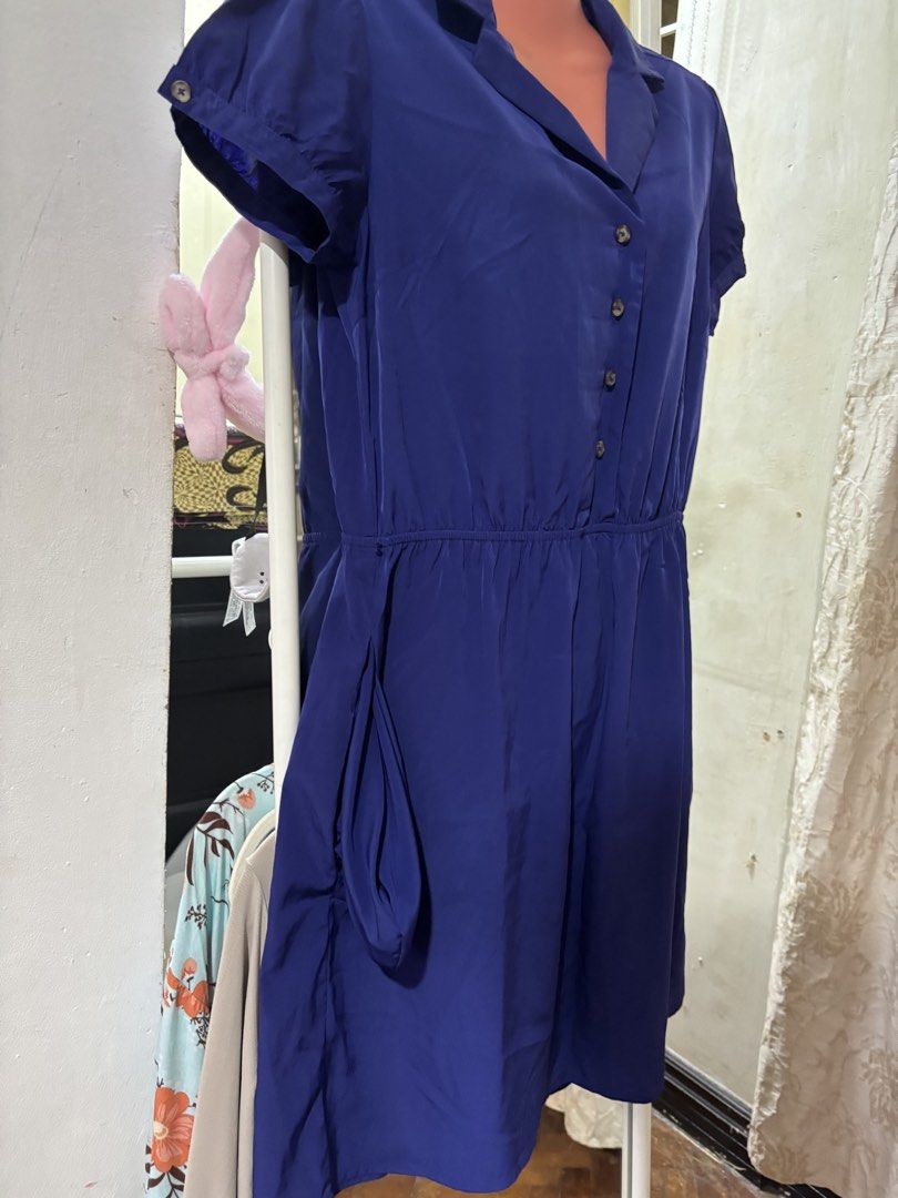 Forever 21 Essentials Royal Blue Button Down Shirt Dress (Category: Dresses) located in Bacoor. Submitted by shamraq (Listing ID 1449203030, Image 3). Description: - Royal blue shirt dress from Forever 21 Essentials - Short sleeves with button cuff details - Elasticated waist for a comfortable fit - Full button-down front - Convenient side pockets - Versatile for casual outings or dressing up.