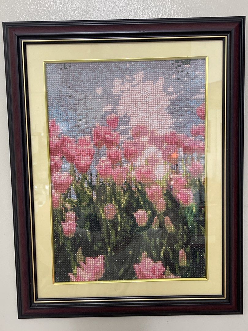 Framed Diamond Painting Tulips Art (Category: Art & Prints) located in Manila. Submitted by phoebe1.23.7 (Listing ID 1449147132, Image 1). Description: FINISHED DIAMOND PAINTING WITH FRAME - Stunning framed diamond painting featuring vibrant pink tulips. - Detailed and high-quality artwork. - Comes in a dark wood frame with elegant cream matting. - Ready to hang, making it an effortless addition to your home decor. - Adds a touch of beauty and co