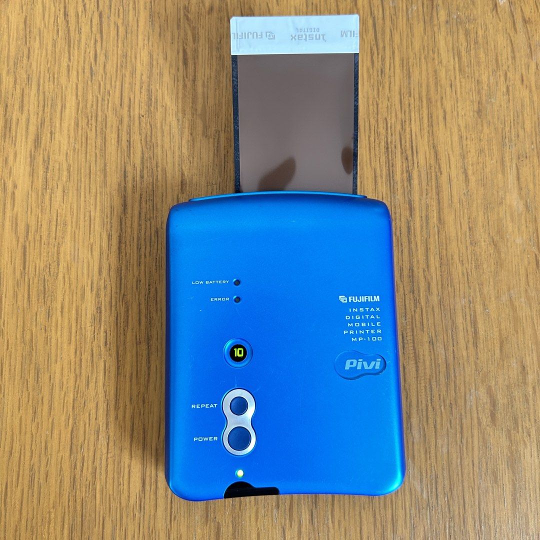 Fujifilm Instax Digital Mobile Printer Pivi MP-100 (Category: Other Photography Accessories) located in Las Pinas. Submitted by pl4y_it_4g4in (Listing ID 1449109648, Image 2). Description: Used Tested battery and dummy film only No sample photo Buttons ok Pls check photos for cosmetic condition .