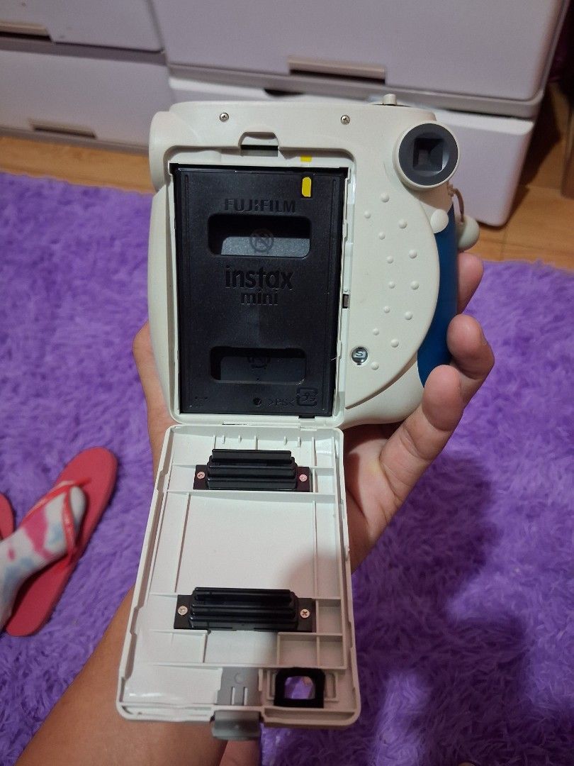 Fujifilm Instax Mini 7S Instant Camera with Clear Case (Category: Cameras) located in Baguio. Submitted by ownedshopps (Listing ID 1449182417, Image 3). Description: - Fujifilm Instax Mini 7S camera - Includes clear protective case - Built-in flash - Adjustable brightness settings - Clean battery compartment - Ideal for instant photo memories - Ready for your next adventure!.