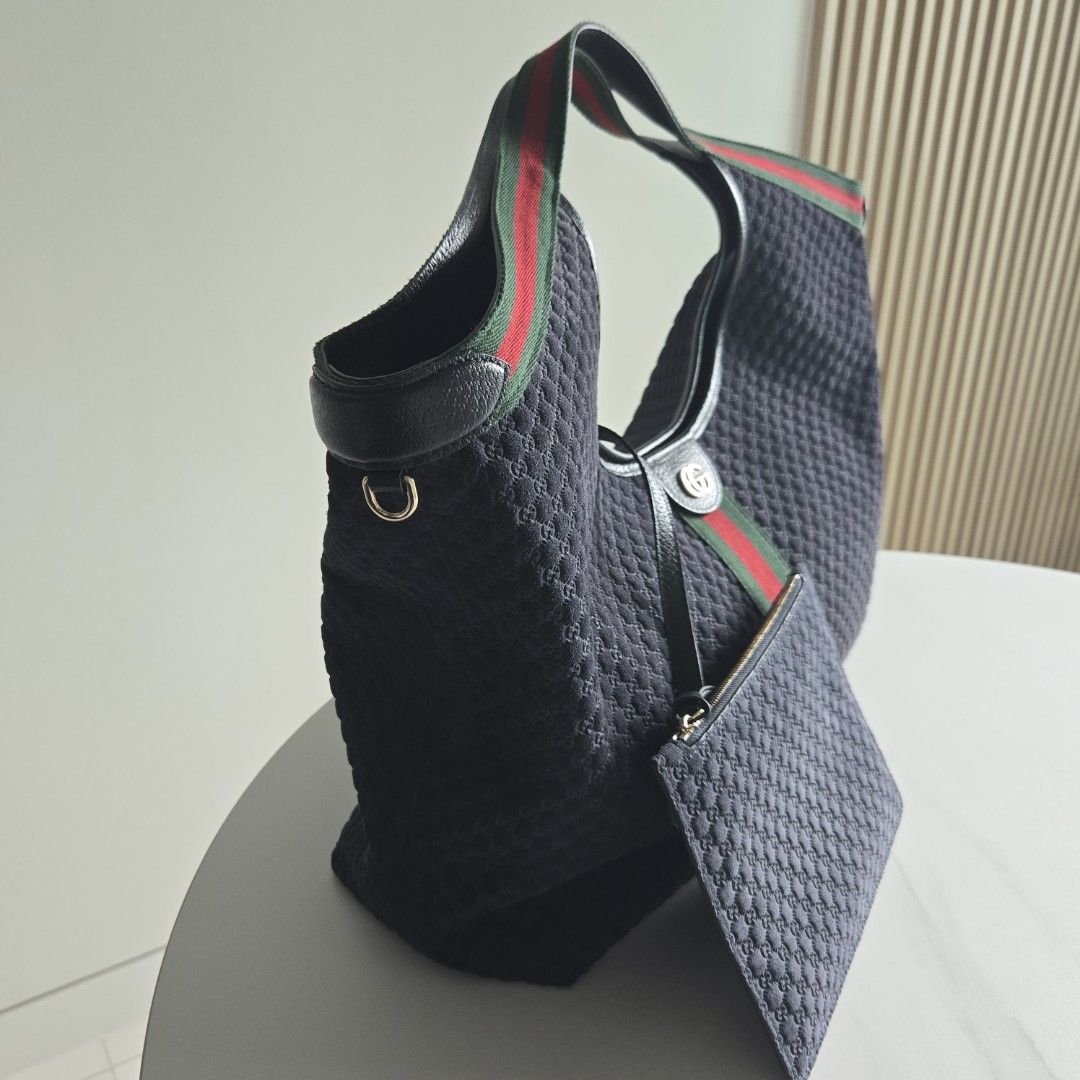 GG Giglio Large Tote (Category: Luxury Bags & Wallets) located in Paranaque City. Submitted by dclutterqueen (Listing ID 1449175070, Image 3). Description: Gucci Giglio Large Tote Limited Edition Navy Blue Suede 💯 Genuine Suede with leather trims and nylon lining ⭐️ Comes with detachable pouch 🇯🇵 Acquired preloved from Japan 👜 Measures approximately 15.7 inches width at the base, 21 inches width across the top x 18 inches height.