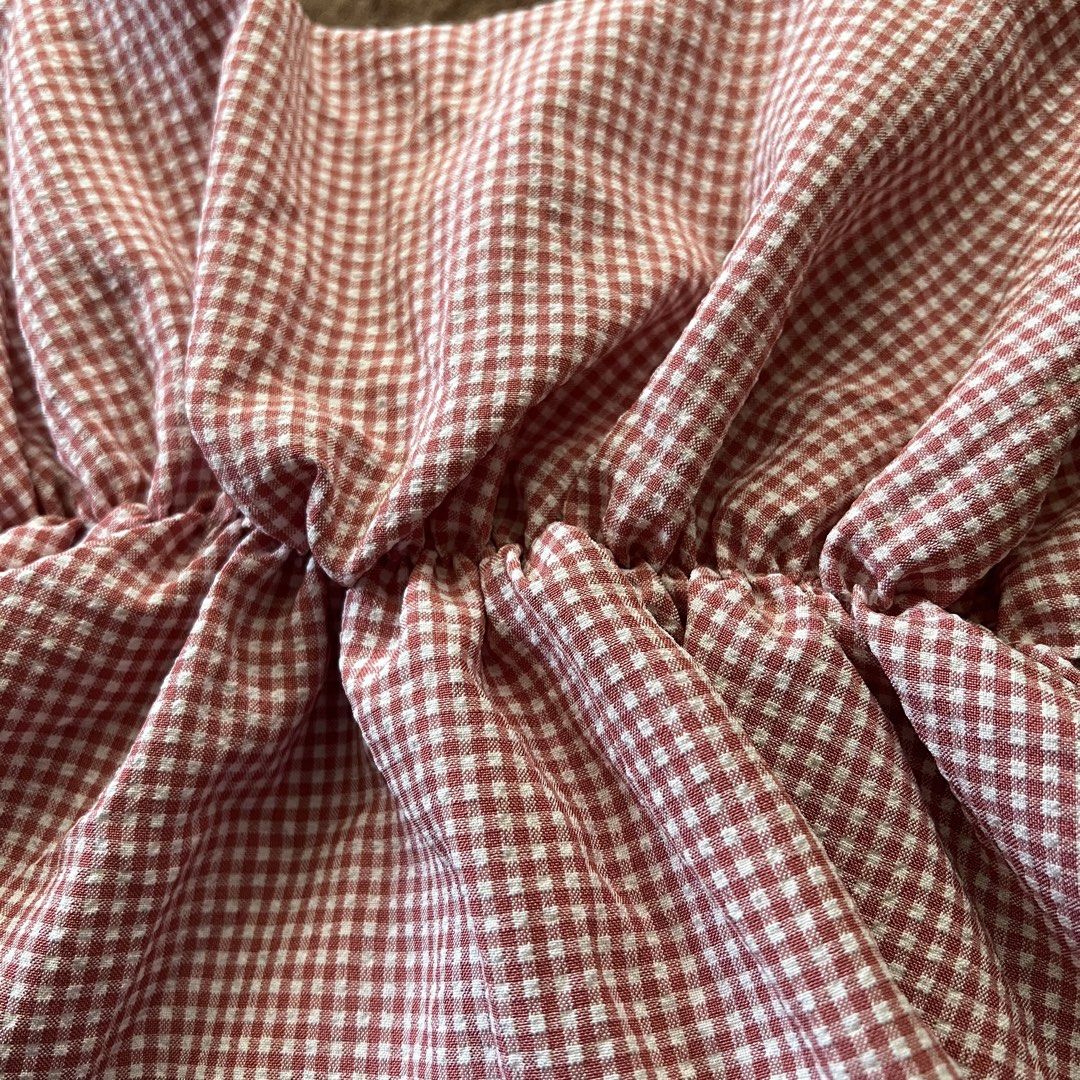 Gingham red and white flowy peplum strappy top (Category: Sleeveless) located in Makati City. Submitted by monu__ (Listing ID 1449173269, Image 2). Description: Gingham red and white patterned top Very stretchy Can fit sizes Small-Large Spaghetti strap top Super cutesy, coquette core, babydoll type top Flowy and airy fabric, not too thick, not too thin NOT SEE THRU .