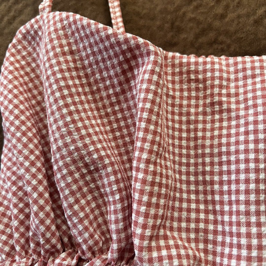 Gingham red and white flowy peplum strappy top (Category: Sleeveless) located in Makati City. Submitted by monu__ (Listing ID 1449173269, Image 3). Description: Gingham red and white patterned top Very stretchy Can fit sizes Small-Large Spaghetti strap top Super cutesy, coquette core, babydoll type top Flowy and airy fabric, not too thick, not too thin NOT SEE THRU .