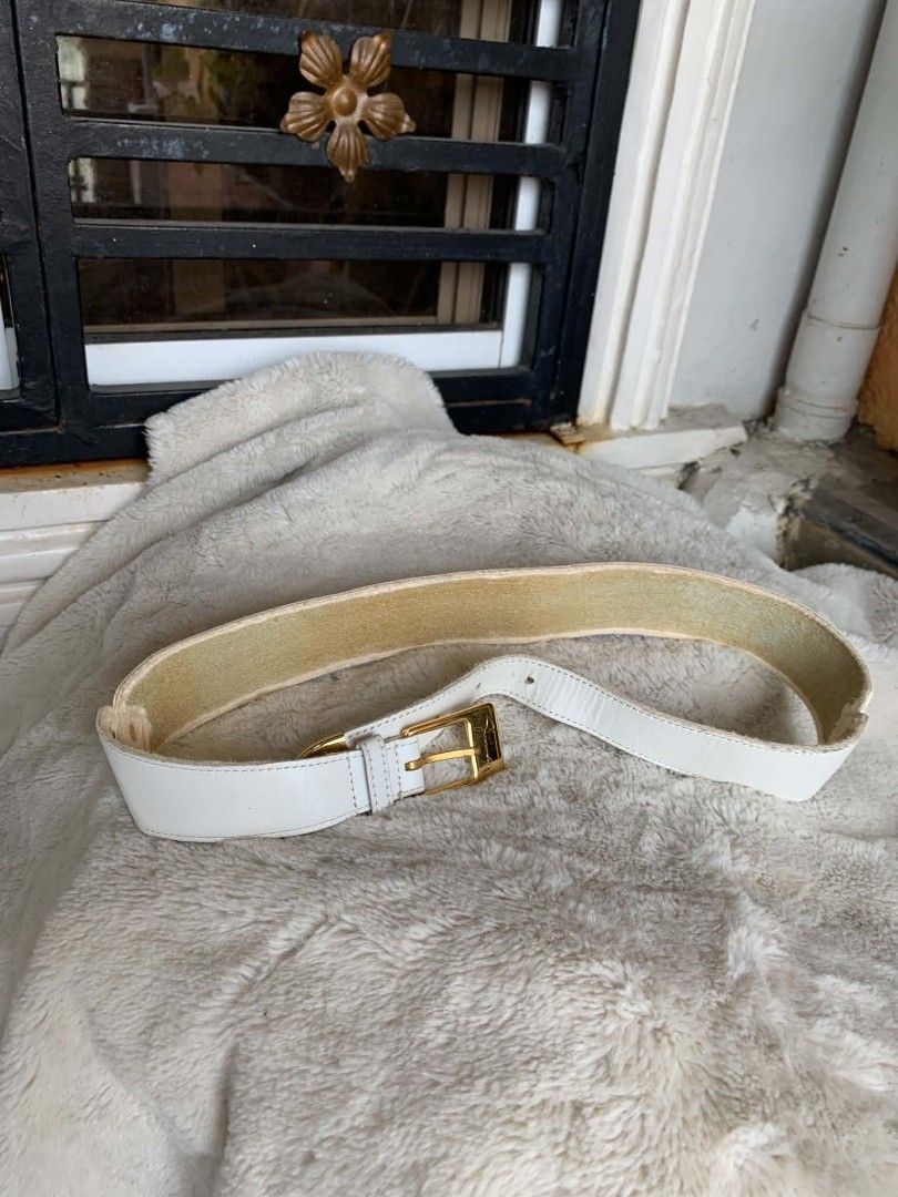 Givenchy White Leather Belt with Gold Buckle (Category: Belts) located in Taguig. Submitted by madisam (Listing ID 1449151504, Image 1). Description: - Authentic Givenchy white leather belt - Features a gold buckle - Iconic Givenchy logo detail size: 1st hole:27 inches 2ndhole:28 inches 3rdhole:29 inches Top to bottom 31 inches - Classic and versatile accessory - Pairs well with dresses or trousers - Selling as it's no longer needed.