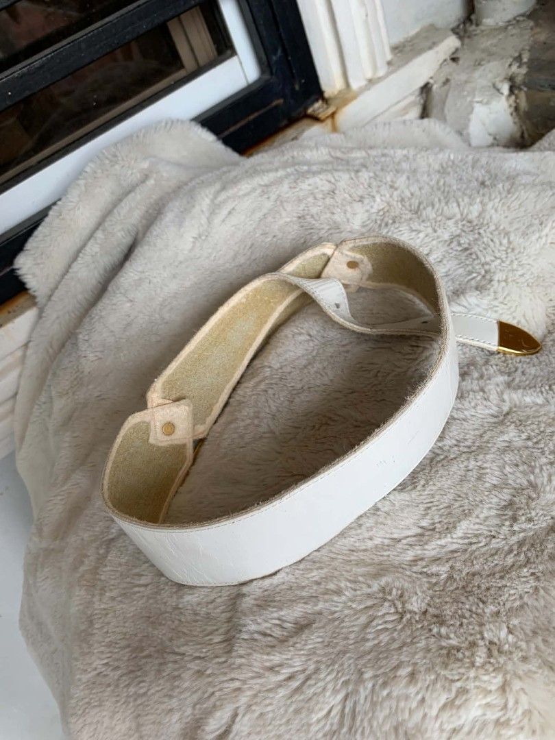 Givenchy White Leather Belt with Gold Buckle (Category: Belts) located in Taguig. Submitted by madisam (Listing ID 1449151504, Image 2). Description: - Authentic Givenchy white leather belt - Features a gold buckle - Iconic Givenchy logo detail size: 1st hole:27 inches 2ndhole:28 inches 3rdhole:29 inches Top to bottom 31 inches - Classic and versatile accessory - Pairs well with dresses or trousers - Selling as it's no longer needed.