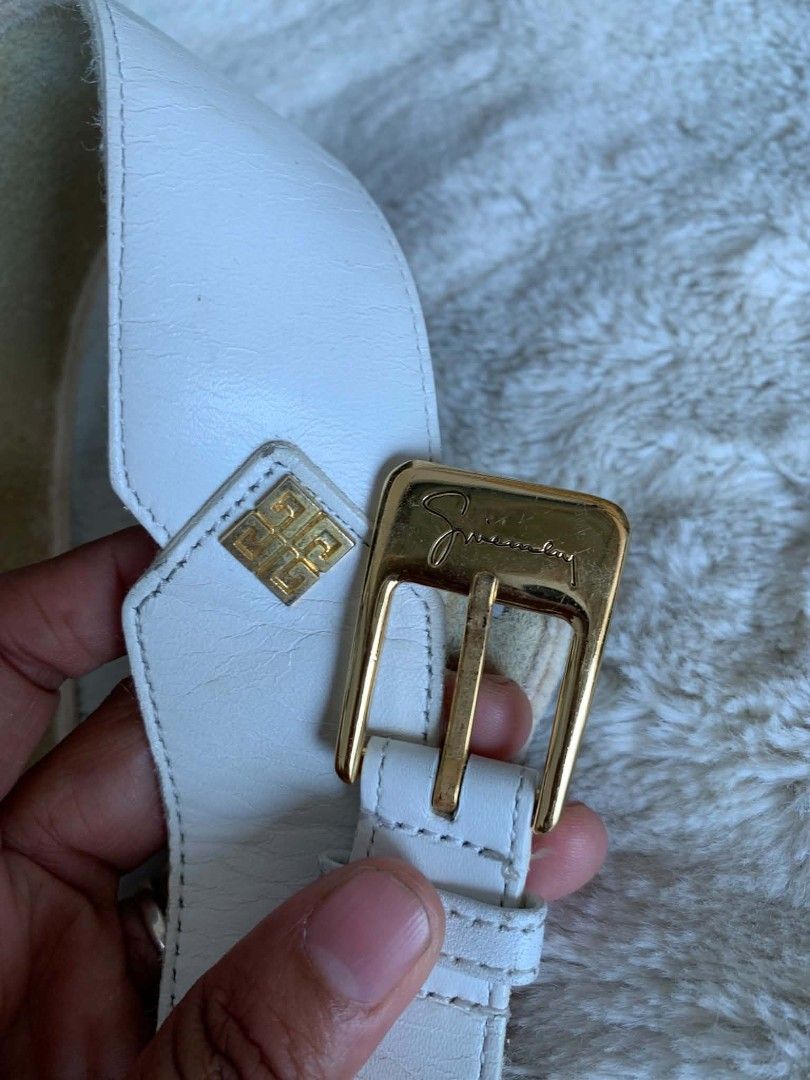 Givenchy White Leather Belt with Gold Buckle (Category: Belts) located in Taguig. Submitted by madisam (Listing ID 1449151504, Image 3). Description: - Authentic Givenchy white leather belt - Features a gold buckle - Iconic Givenchy logo detail size: 1st hole:27 inches 2ndhole:28 inches 3rdhole:29 inches Top to bottom 31 inches - Classic and versatile accessory - Pairs well with dresses or trousers - Selling as it's no longer needed.