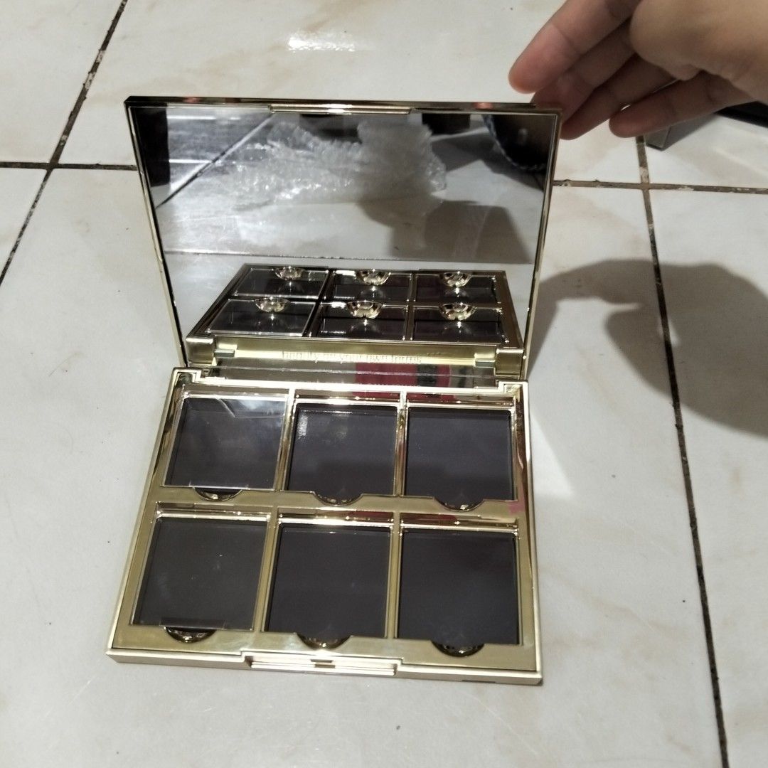 GRWM Makeup Palette (Category: Makeup) located in Muntinlupa City. Submitted by jaehyunpeaches (Listing ID 1449150176, Image 3). Description: - Pink empty makeup palette - 6 slots for eyeshadows or blushes - Gold interior with a mirror - Ideal for organizing and customizing your makeup collection.