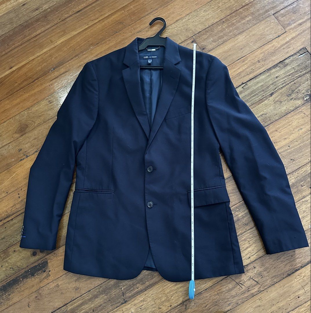 H E by MANGO Navy Blue Two-Button Blazer (Category: Coats, Jackets and Outerwear) located in Pasig City. Submitted by carouselitems (Listing ID 1449147194, Image 2). Description: - Classic navy blue blazer from HE by Mango - Two-button closure - Two front pockets and one chest pocket - Fully lined interior - Versatile for formal or smart casual wear - Measurements available in photos - Please check photos for condition and details - length 31 inc