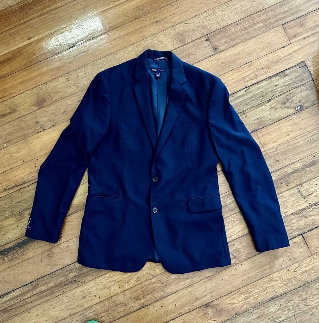H E by MANGO Navy Blue Two-Button Blazer (Category: Coats, Jackets and Outerwear) located in Pasig City. Submitted by carouselitems (Listing ID 1449147194, Image 1). Description: - Classic navy blue blazer from HE by Mango - Two-button closure - Two front pockets and one chest pocket - Fully lined interior - Versatile for formal or smart casual wear - Measurements available in photos - Please check photos for condition and details - length 31 inc