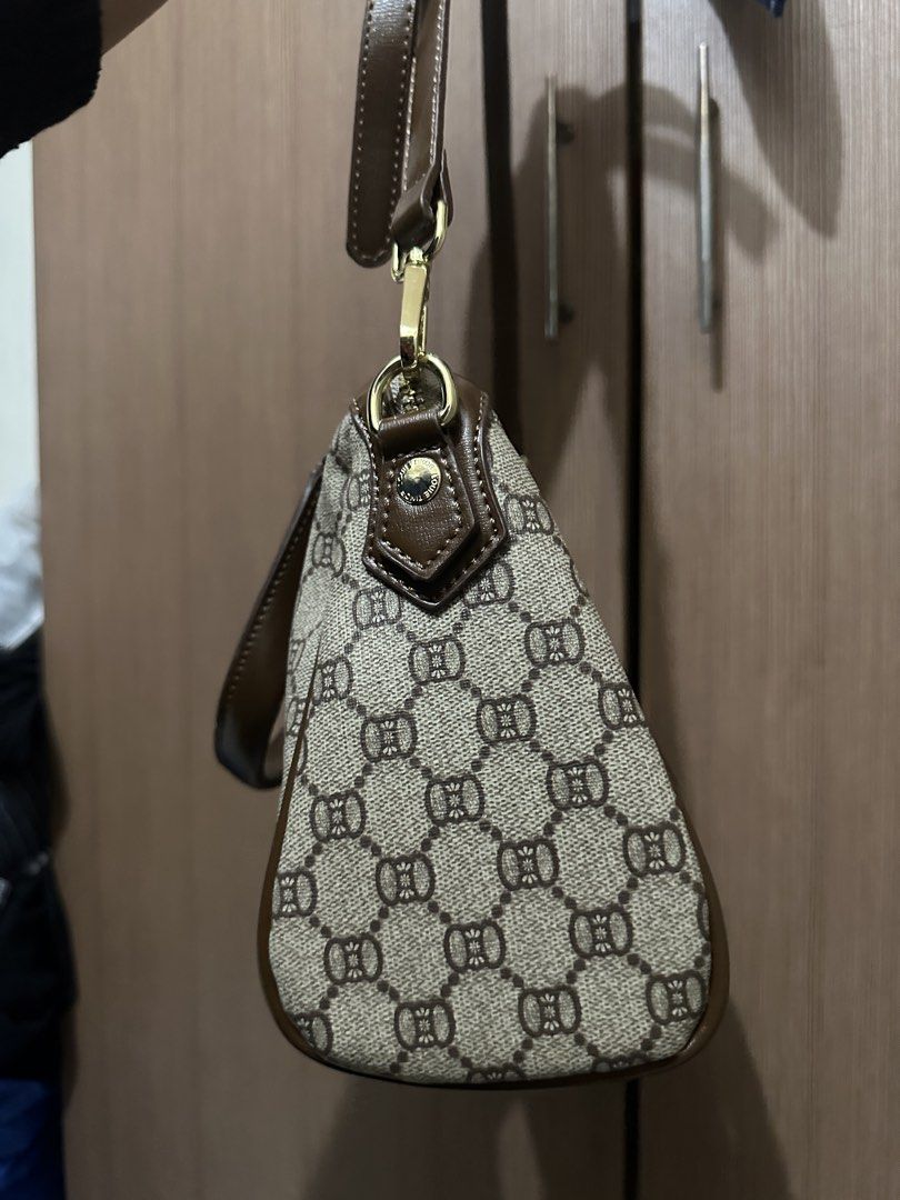 JOVANNI Monogrammed Satchel Bag with Charm (Category: Luxury Bags & Wallets) located in Pasig City. Submitted by theinternetz (Listing ID 1449188552, Image 2). Description: selling this brand new JOVANNI satchel bag purchased from the SM store. it has never been used and still comes with its original tag! specifics: brand: Jovanni condition: brand new with tag color: classic brown and beige pattern with adjustable shoulder strap for a comfortable