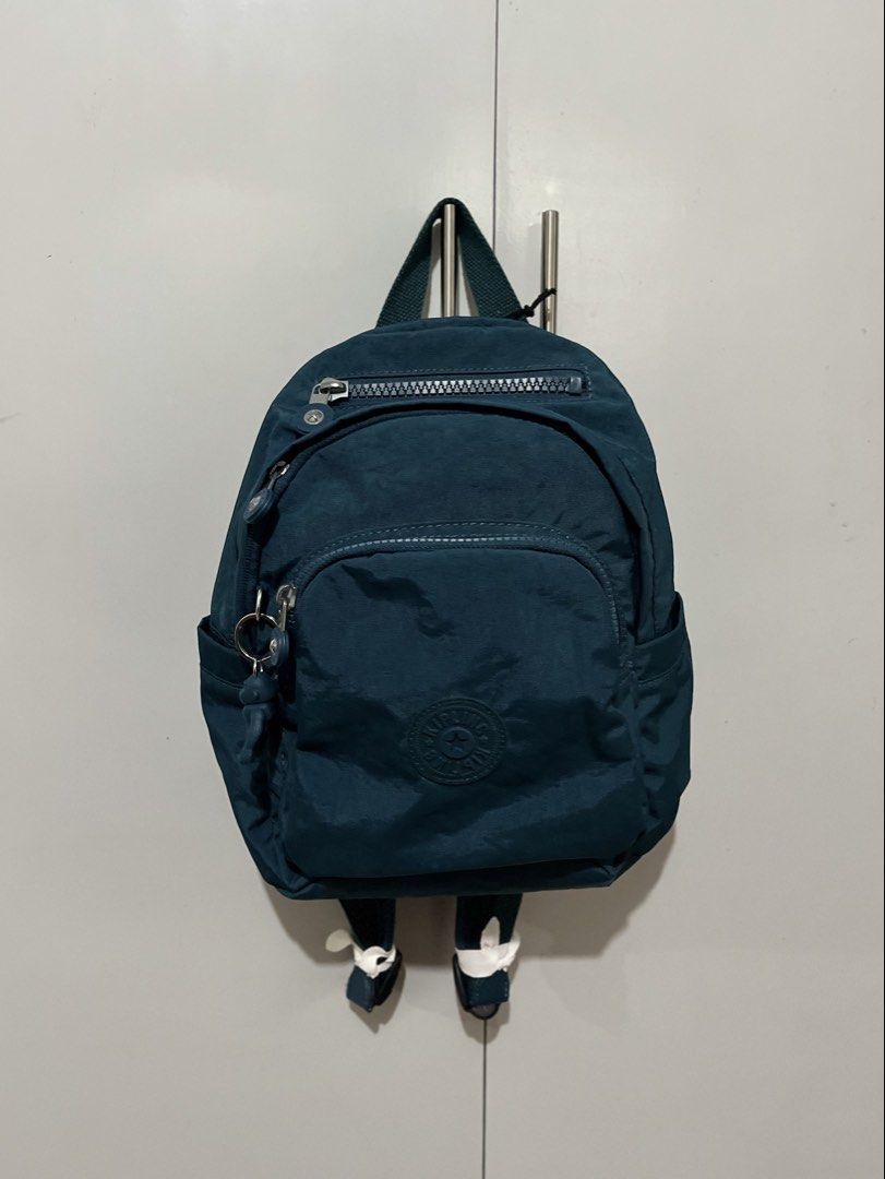 Kipling Delia Mini Backpack | NEW (Category: Backpacks) located in Cavite. Submitted by meijical (Listing ID 1449110224, Image 1). Description: BRAND NEW with tags Color: Cosmic Emerald (Deep Teal Blue) Comes with signature Kipling charm This backpack has multiple zipper and pocket compartments. Lightweight and durable material. Perfect for commute and daily use :) Third photo for size ref. RFS: Too many bags 📍Pilar, Las Piñas - Alabang area.