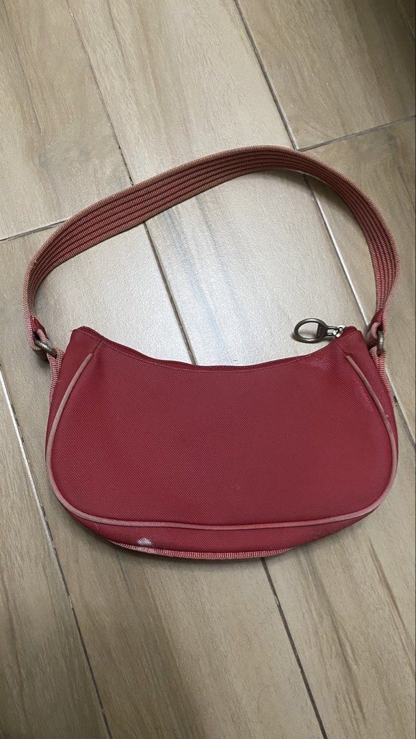 Lacoste Vintage Shoulder Bag (Category: Shoulder Bags) located in Las Pinas. Submitted by baeksilog (Listing ID 1449300813, Image 2). Description: Lacoste Red Handbag - Major defects ‼️ - Can send more pictures - Cannot verify auth3nticity - Price still nego! MOP: GCash, Maya, Bank Transfer MOD: J&T, Lalamove, Grab c/o buyer Can also meet up around las piñas or alabang .