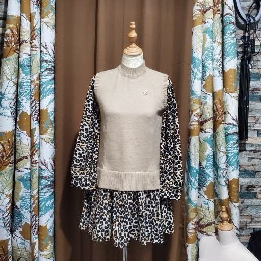 Leopard Print Two-Piece Set with Beige Vest (Category: Sets or Coordinates) located in Batangas. Submitted by 8ACesonlineshop (Listing ID 1449302120, Image 1). Description: - Leopard print long sleeve top - Matching leopard print skirt - Beige knit vest with mock neck - Small emblem detail on vest - Bold and playful statement outfit.