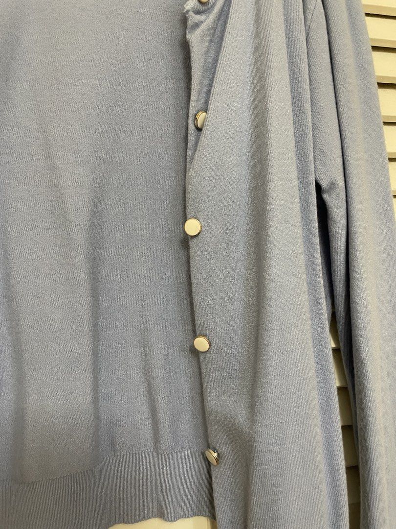 Light Blue Button-Up Cardigan with Pearl Buttons (Category: Coats, Jackets and Outerwear) located in Calamba. Submitted by melibear (Listing ID 1449242381, Image 2). Description: - Light blue knit cardigan - Features pearl-like buttons down the front - Long sleeves - Soft and comfortable material - Classic and versatile design, perfect for layering over tops or dresses.