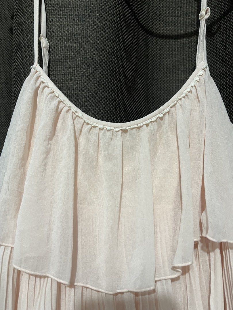 Light Pink Tiered Chiffon Ruffle Dress (Category: Dresses) located in Mandaluyong City. Submitted by blzstr (Listing ID 1449277437, Image 2). Description: - Adorable light pink dress - Features charming ruffles and pleats - adjustable spaghetti straps - Smooth, silky lining for comfort - Tagged as Size 40.