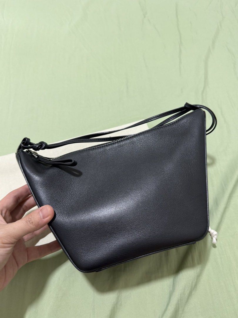 Loewe Black Leather Mini Gate Dual Bag (Category: Luxury Bags & Wallets) located in Manila. Submitted by midlemanalac (Listing ID 1449112649, Image 3). Description: - Genuine black leather mini bag - Secure zip closure - Structured base for stability - Compact size, ideal for carrying essentials - Beautiful leather sheen - Embossed Loewe logo on a separate leather tab - Comes with a protective dust bag.