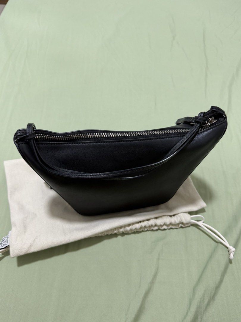 Loewe Black Leather Mini Gate Dual Bag (Category: Luxury Bags & Wallets) located in Manila. Submitted by midlemanalac (Listing ID 1449112649, Image 1). Description: - Genuine black leather mini bag - Secure zip closure - Structured base for stability - Compact size, ideal for carrying essentials - Beautiful leather sheen - Embossed Loewe logo on a separate leather tab - Comes with a protective dust bag.