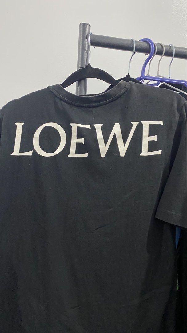 LOEWE Black Skull & Crossbones T-Shirt (Category: Tshirts & Polo Shirts ) located in Porac. Submitted by moethrifter (Listing ID 1449167060, Image 2). Description: - Authentic black LOEWE t-shirt - Features a striking white skull and crossbones graphic on the front - Subtle LOEWE logo detail on the back - Classic crew neck and short sleeves - Ideal for everyday casual wear.