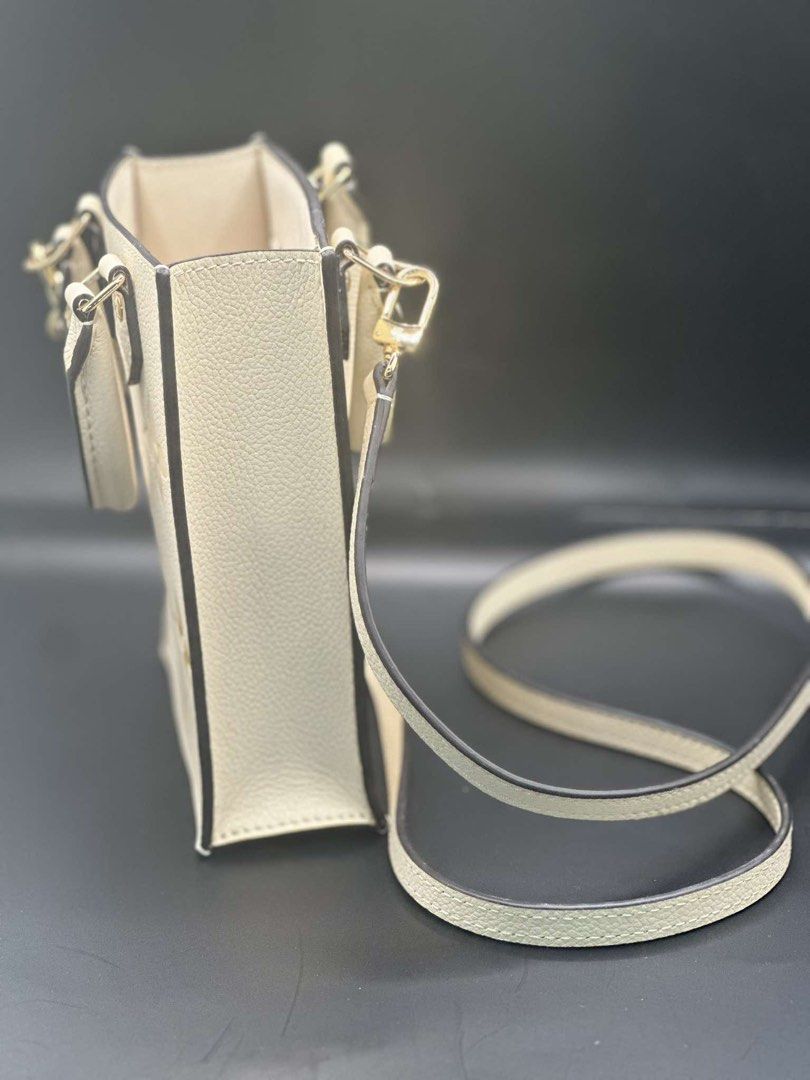 Louis Vuitton Monogram Empreinte Nano Speedy Bag (Category: Luxury Bags & Wallets) located in Midsayap. Submitted by bagski (Listing ID 1449325826, Image 3). Description: - Louis Vuitton Nano Speedy bag - Color: Creamy white with yellow and beige monogram empreinte - Hardware: Gold - Strap: Adjustable, for crossbody wear - Interior: Card slot - Includes: Dust bag and care card - Ideal for carrying essentials.