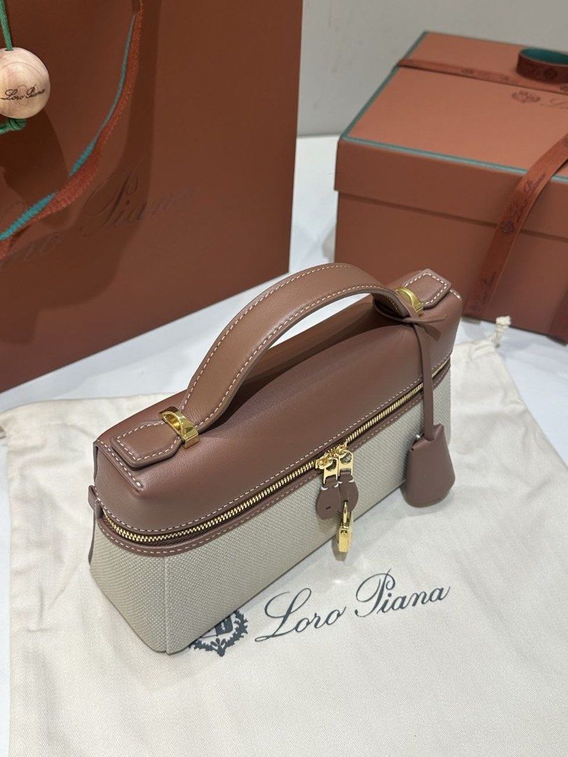 LP (Category: Bags & Wallets) located in Kuala Lumpur. Submitted by kiokz (Listing ID 1449297828, Image 3). Description: **Loro Piana Gift Box Included 🎁** **Extra Bag 23 Handbag (Canvas)** Crafted from premium Saddle leather and canvas, this elegant handbag features exquisite contrast stitching that highlights Loro Piana’s refined craftsmanship. Designed for versatility, it can be carried by hand or worn crossbody. The dual-zip closure is adorn