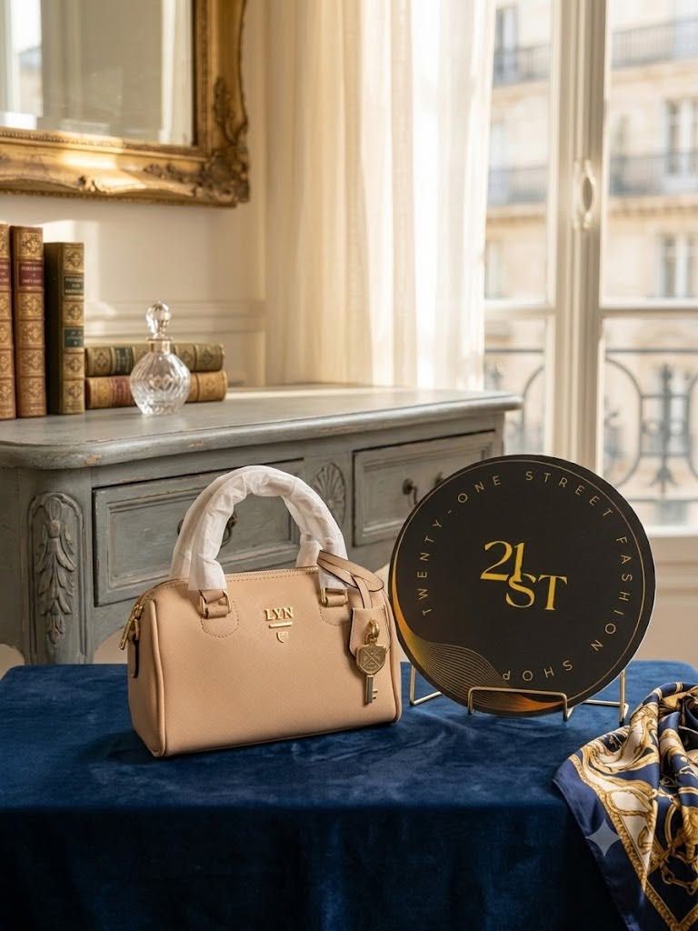 LYN Boston Bag - Navy Blue (Category: Luxury Bags & Wallets) located in Manila. Submitted by youngcrystal.667a6c1000 (Listing ID 1449262244, Image 2). Description: - Brand: LYN - Style: Boston Bag - Color: Deep Navy Blue - Features: Top handles, detachable strap, cute key charm - Interior: Spacious, ideal for essentials - Versatility: Great for daily use or weekend getaways.