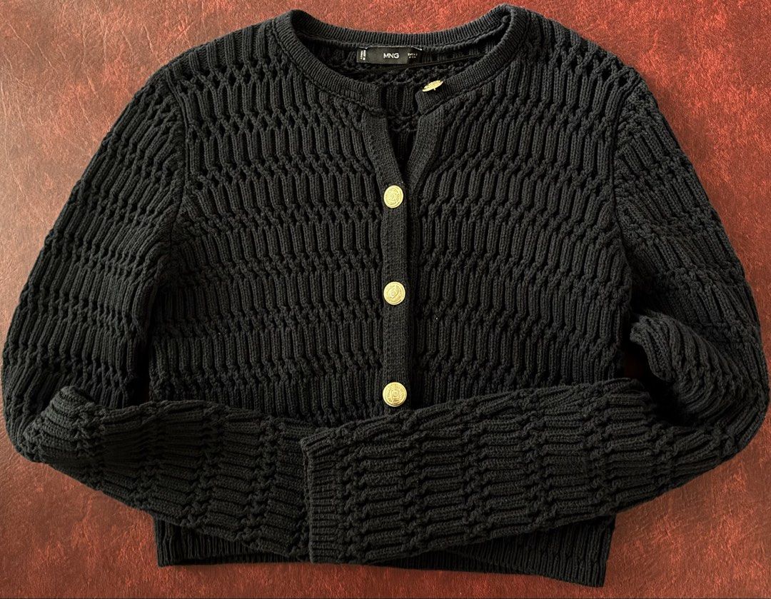 Mango Cropped Knit Cardigan with Gold Buttons (Category: Coats, Jackets and Outerwear) located in Muntinlupa City. Submitted by decluttering22.22 (Listing ID 1449111113, Image 2). Description: - Brand: Mango - Color: Navy - Material: Textured knit - Features: Gold button closures - Length: Cropped - Styling: Pairs well with jeans or skirts - Feel: Comfortable and stylish.