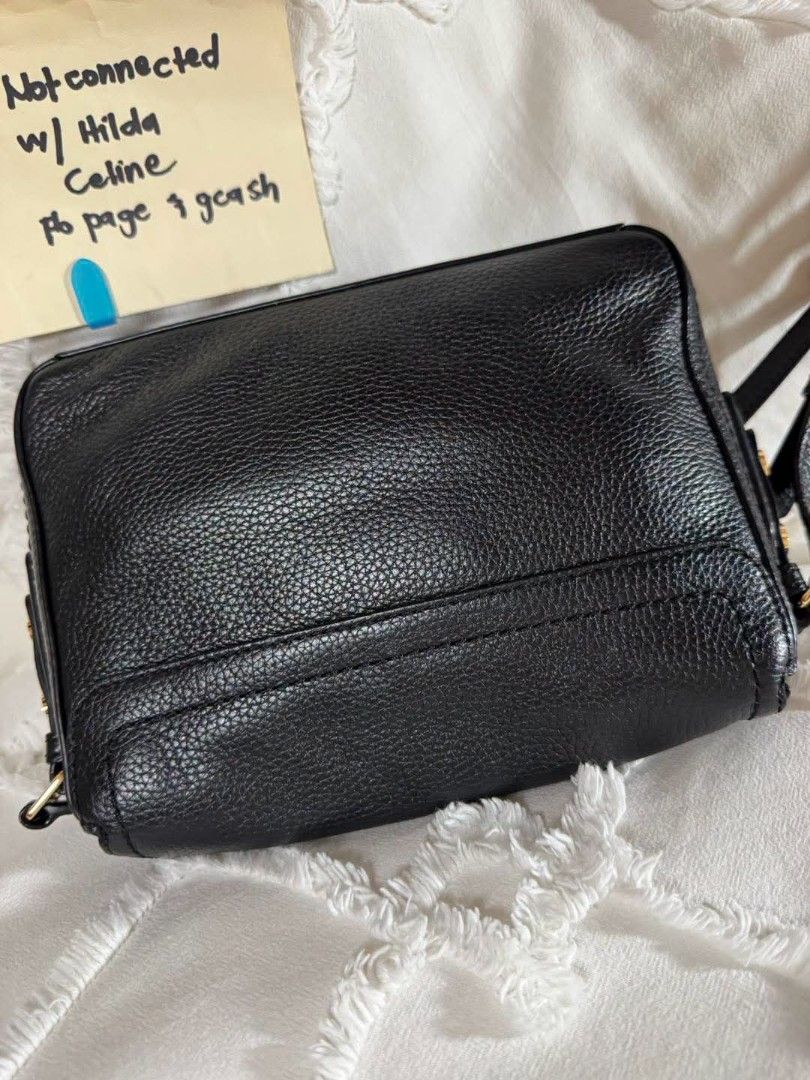 Marc Jacobs Black Leather Crossbody Bag (Category: Luxury Bags & Wallets) located in Bulacan. Submitted by vintage_purge (Listing ID 1449136311, Image 3). Description: - Brand: Marc Jacobs - Material: Black pebbled leather - Hardware: Gold-tone - Closure: Zipper top - Strap: Adjustable crossbody strap - Dimensions: Approx. 8" wide x 5" tall - Features: Ideal for everyday essentials, stylish and practical..