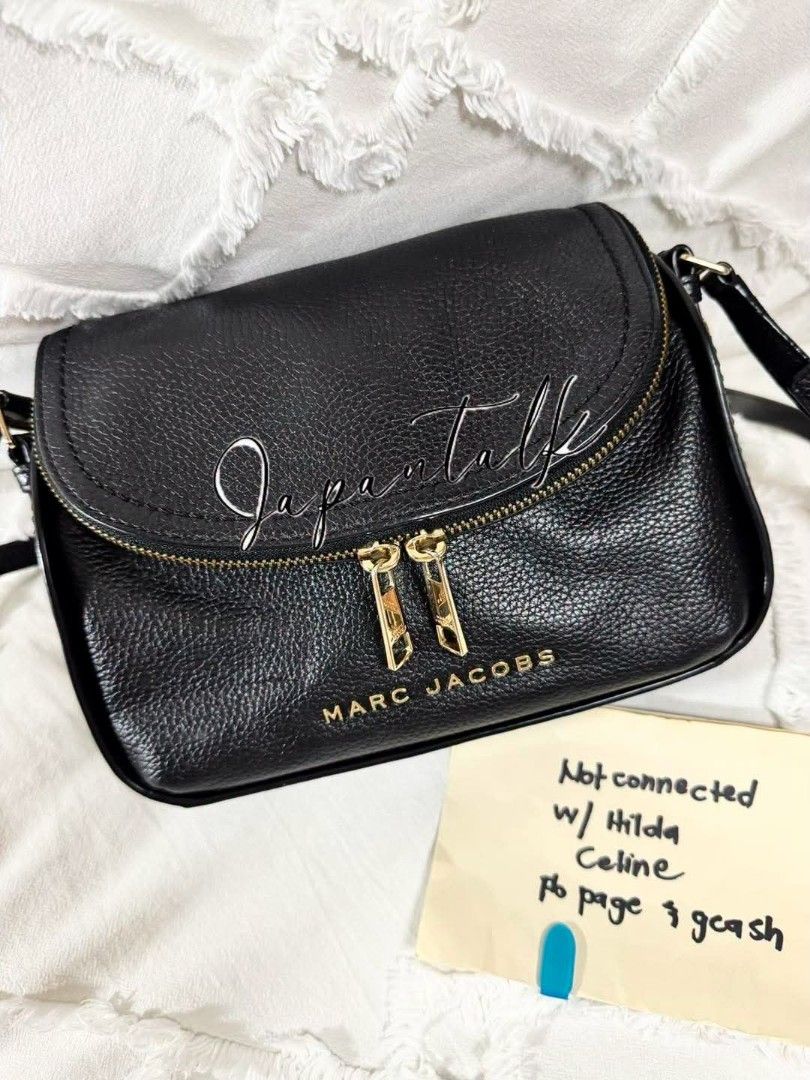 Marc Jacobs Black Leather Crossbody Bag (Category: Luxury Bags & Wallets) located in Bulacan. Submitted by vintage_purge (Listing ID 1449136311, Image 1). Description: - Brand: Marc Jacobs - Material: Black pebbled leather - Hardware: Gold-tone - Closure: Zipper top - Strap: Adjustable crossbody strap - Dimensions: Approx. 8" wide x 5" tall - Features: Ideal for everyday essentials, stylish and practical..