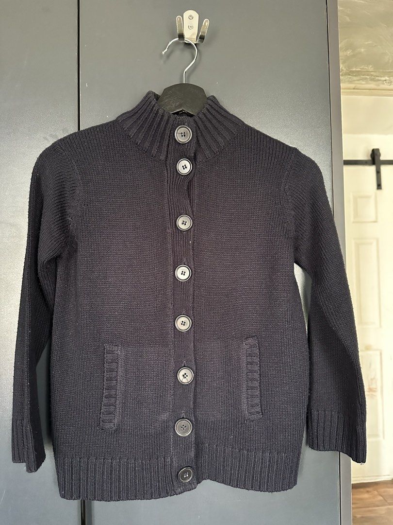 Marks & Spencer Navy Blue Button Up Cardigan, S-M (Category: Coats, Jackets and Outerwear) located in Cavite. Submitted by Ersdecluts (Listing ID 1449106905, Image 1). Description: - Navy blue Marks & Spencer cardigan - Button-up front - Mock neck collar - Two front pockets - Ribbed cuffs and hem - Ideal for layering - Comfortable and classic style.