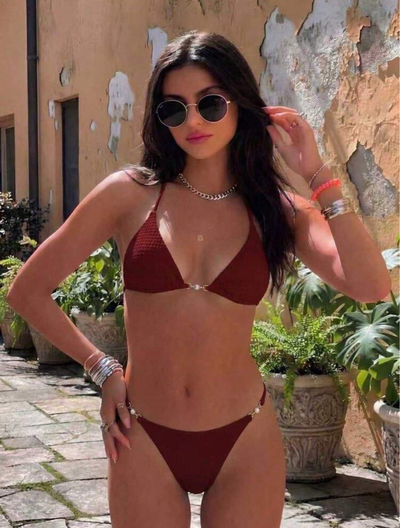Maroon Triangle Bikini with Pearl Details (Category: Bikinis & Swimsuits) located in Manila. Submitted by yo_hanna (Listing ID 1449139188, Image 1). Description: - Cute maroon bikini set - Triangle top with pearl accents - Matching bottoms with pearl details on the sides - Ideal for beach or pool - Comfortable and stylish.