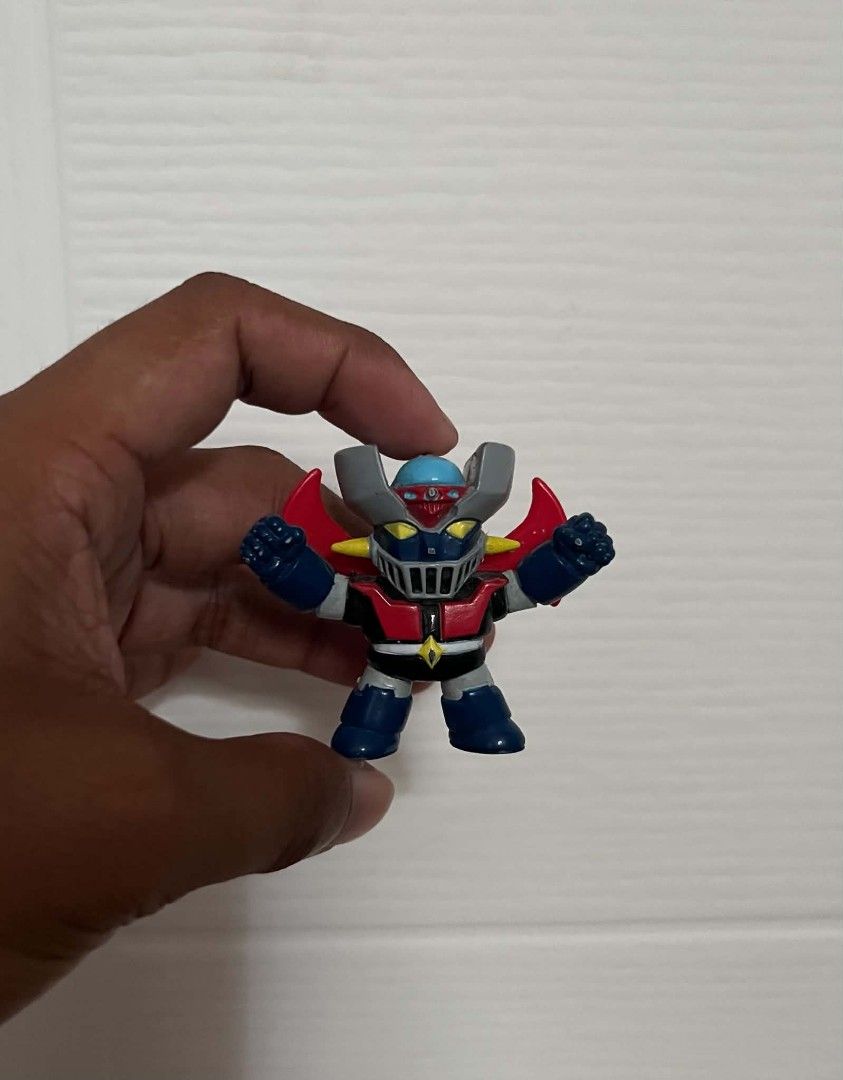MAZINGER Z KEYCHAIN MINI FIGURE (Category: Figurines & Statues) located in Villasis. Submitted by aalvar.collection (Listing ID 1449219682, Image 3). Description: Selling Mazinger Z Keychain Mini Figure for Php250 only. -wyswyg/loose condition -issue: missing chain, visible hole of the chain marked at the top of the head -with markings Mop: Gcash Mod: Meetup, J&T or LBC (COP/COD) My Location: Villasis, Pangasinan Shipping: Open for shipping, Buye