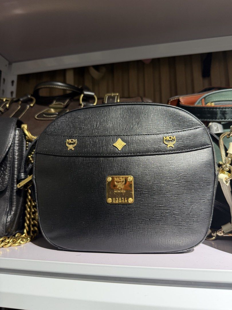 MCM Black Leather Shoulder Bag (Category: Luxury Bags & Wallets) located in Taguig. Submitted by xylasprelovedbag (Listing ID 1449281002, Image 1). Description: - Authentic black MCM shoulder bag - Features iconic MCM logo hardware - Beautifully textured leather - Elegant gold chain strap - Serial number U3814 clearly visible on front plaque - Ideal for everyday use.