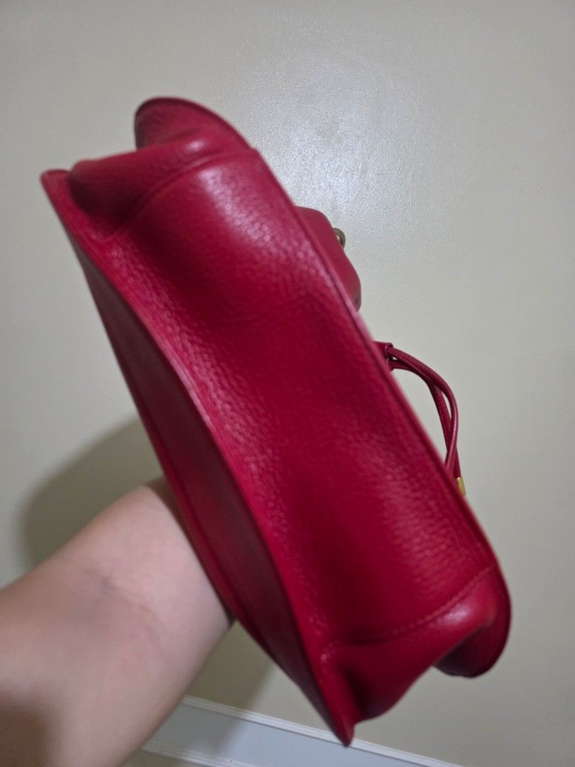 MCM München Red Leather Drawstring Bucket Bag (Category: Luxury Bags & Wallets) located in Las Pinas. Submitted by andthelike (Listing ID 1449251992, Image 3). Description: - Authentic MCM red leather bucket bag - Secure drawstring closure - Elegant gold-tone hardware - Signature MCM logo plate on the front - Two charming red leather tassels with gold caps - Ideal for everyday style and practicality - A timeless MCM classic.