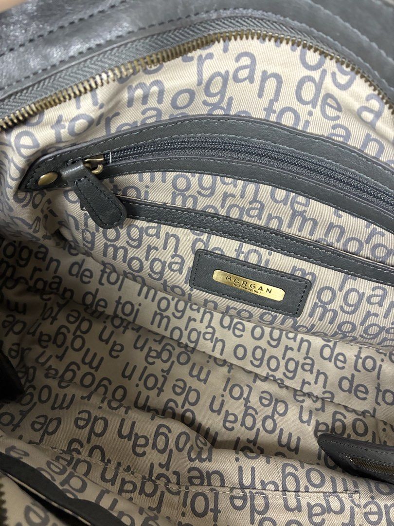 MORGAN Grey Leather Handbag with Gold Chain (Category: Luxury Bags & Wallets) located in Manila. Submitted by tomtomsworld (Listing ID 1449191099, Image 3). Description: - MORGAN grey leather handbag - Detachable gold chain strap - Multiple zippered pockets on the front - Interior lining with MORGAN logo pattern - Stylish and perfect for everyday use.