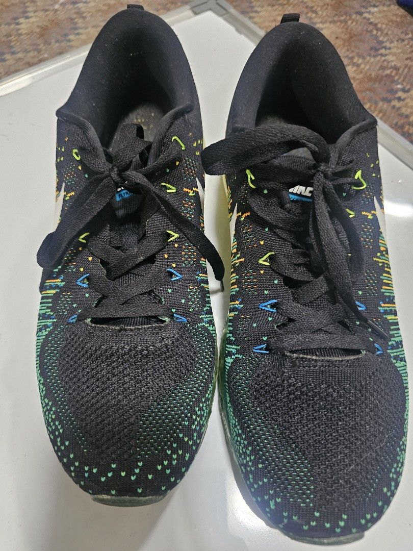 Nike Air Max Flyknit Running Shoes (Category: Sneakers) located in Quezon City. Submitted by ryanstuff.ph (Listing ID 1449144424, Image 1). Description: - Nike Air Max Flyknit running shoes - Color: Black with multi-color knit pattern - Sole: Yellow to green gradient - Closure: Lace-up - Ideal for: Running or casual wear - Please check photos for condition details rate:8.5/10 slightly used no box galing kase balikbayan box rfs: medyo maliit sa ak