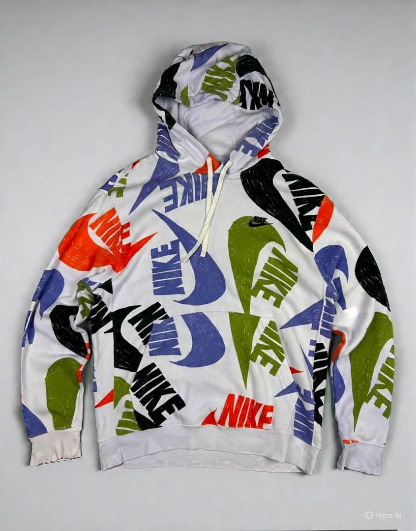Nike All Over Print Hoodie (Category: Hoodies) located in Makati City. Submitted by enchong890 (Listing ID 1449303466, Image 1). Description: - White Nike hoodie with eye-catching all-over graphic print. - Features repeated Nike swoosh and logo in vibrant orange, green, purple, and black. - Includes adjustable drawstring hood for a comfortable fit. - Ideal for everyday casual wear. - A stylish and fun addition to your wardrobe..