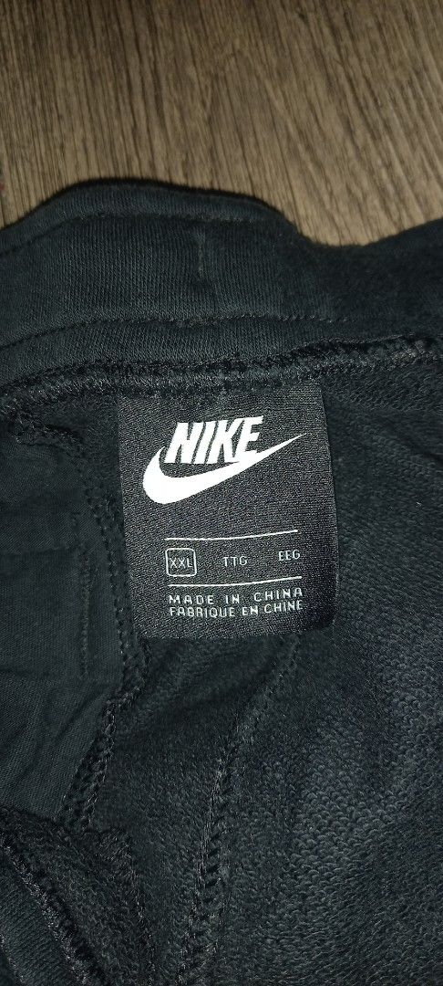 Nike Swoosh Jogger Pants Black (Category: Joggers) located in Imus. Submitted by pampie (Listing ID 1449149202, Image 2). Description: - Black Nike Joggers - Size: XL - Features adjustable drawstring waist - Nike Swoosh branding on waistband and side - Material: 80% Cotton, 20% Polyester - Made in China - Ideal for workouts and casual wear.