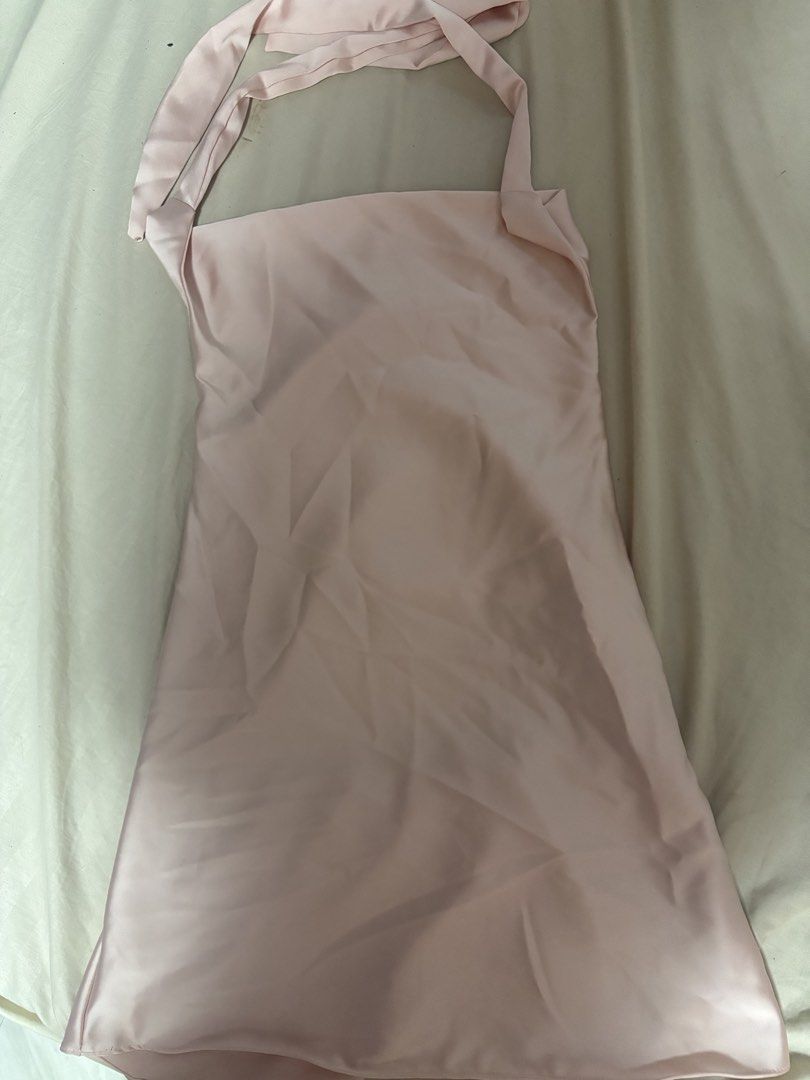 Pink Satin Halter Neck Top (Category: Sleeveless) located in Pasay City. Submitted by faye_xoxo (Listing ID 1449208902, Image 3). Description: - Light pink satin halter top - Beautifully draped front - Sleeveless design Used once for Christmas Party last Dec 2025, this is so neat and very chic too! Best Fit po siguro S-M since medyo maluwag sya sakin I’m mostly small.