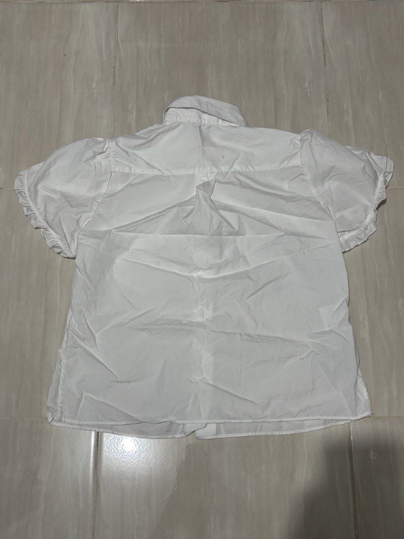 Prada Corset Polo For Womens (Category: Activewear) located in Naga. Submitted by unknwnstreetwear (Listing ID 1449324791, Image 2). Description: VERY GOOD CONDITION SIZE 36 ON TAG WIDTH-18 INCHES LENGTH-22 INCHES NEEDWASH STAIN.
