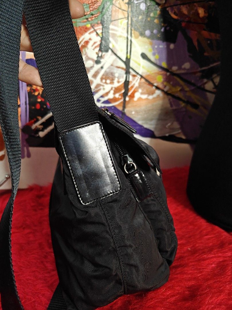 Prada Nylon Crossbody Bag Black (Category: Luxury Bags & Wallets) located in Las Pinas. Submitted by liezel49 (Listing ID 1449152890, Image 3). Description: - Authentic Prada crossbody bag in black nylon. - Features a secure buckle closure on the front flap. - Adjustable shoulder strap for comfortable wear. - Ideal for everyday use, carrying your essentials. - Compact and stylish design..