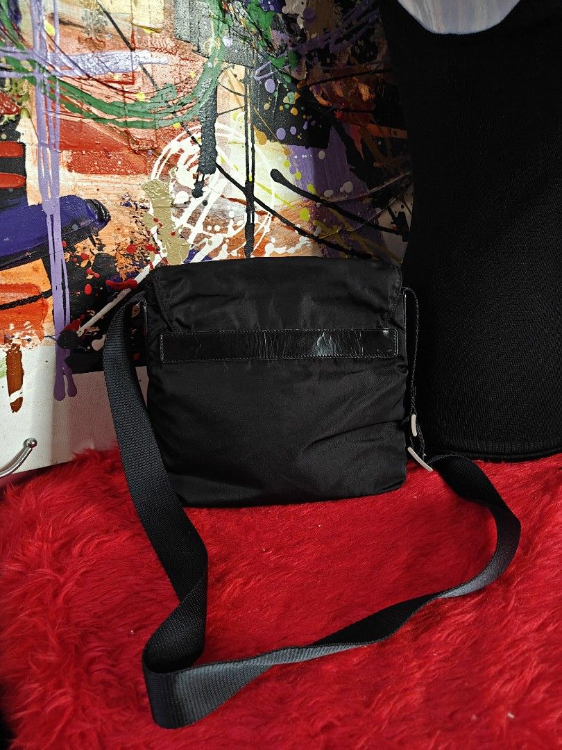 Prada Nylon Crossbody Bag Black (Category: Luxury Bags & Wallets) located in Las Pinas. Submitted by liezel49 (Listing ID 1449152890, Image 2). Description: - Authentic Prada crossbody bag in black nylon. - Features a secure buckle closure on the front flap. - Adjustable shoulder strap for comfortable wear. - Ideal for everyday use, carrying your essentials. - Compact and stylish design..