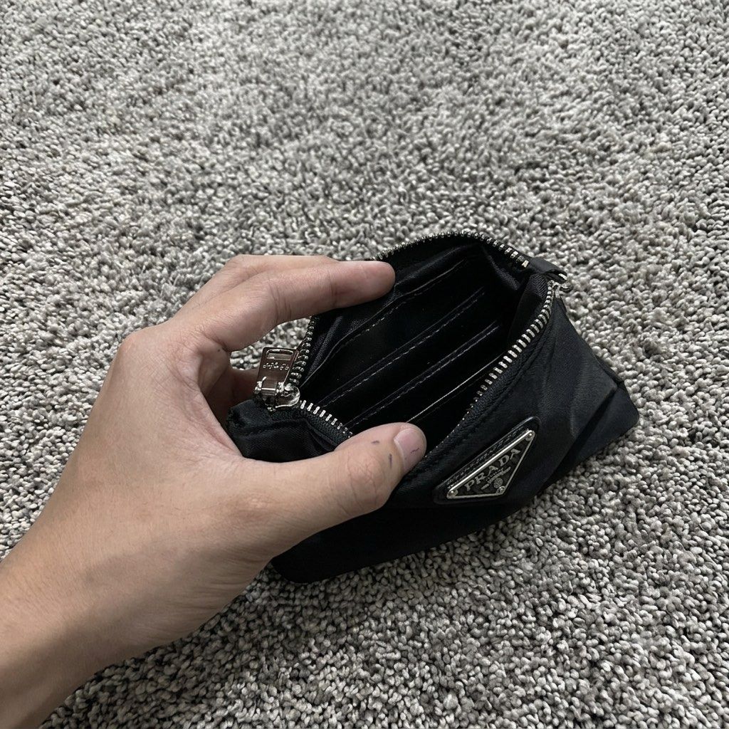 PRADA Nylon Mini Pouch Keychain | PRE-ORDER (Category: Luxury Bags & Wallets) located in Manila. Submitted by thegwpvault (Listing ID 1449182018, Image 3). Description: ✨ PRE-ORDER ONLY A sleek and stylish mini nylon pouch with a keychain attachment—perfect for coins, earbuds, lip balm, cards, or small everyday essentials. Inclusions: • Prada Nylon Mini Pouch Keychain • Prada Presentation Box • Certificate/Tag (as shown) 📦 Condition: Brand New �