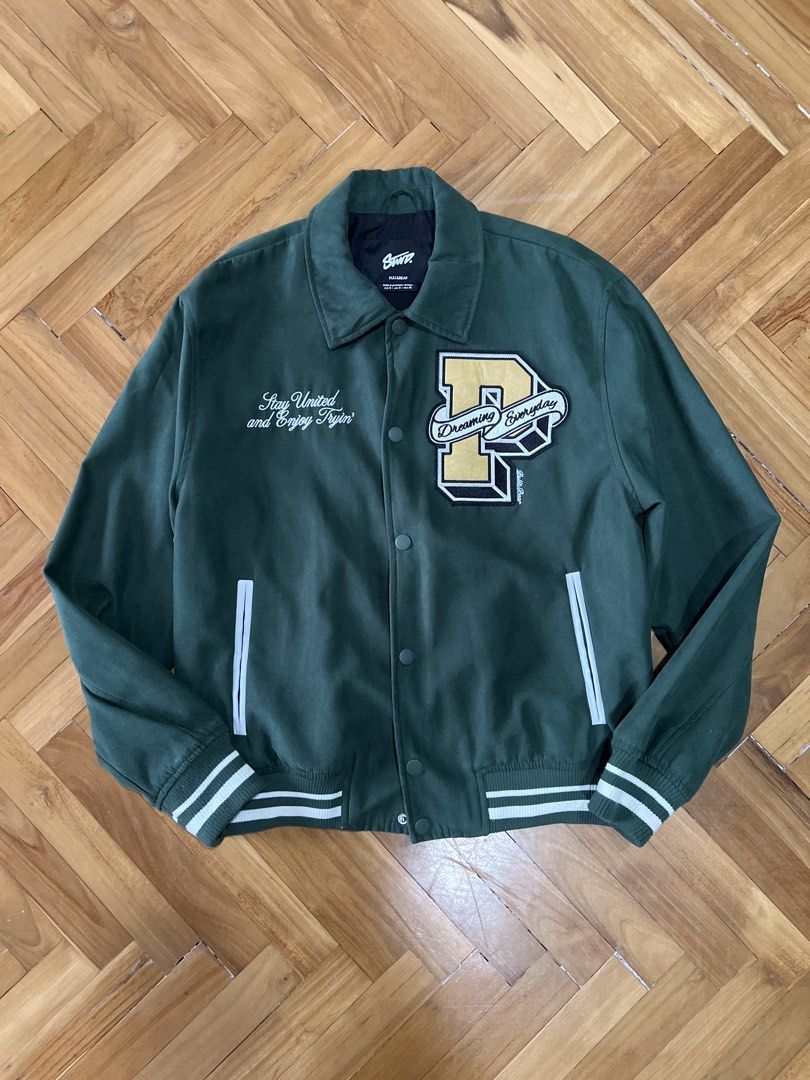 Pull & Bear Varsity Jacket (Category: Coats, Jackets and Outerwear) located in Kuala Lumpur. Submitted by afiqdnn (Listing ID 1449125587, Image 1). Description: condition: 10/10 💯 - Size S (Pit: 23inch, Length: 26inch) - Embroidered patches and text - Faux Suede - Ribbed cuffs and hem - Button-up closure - Two side pockets.