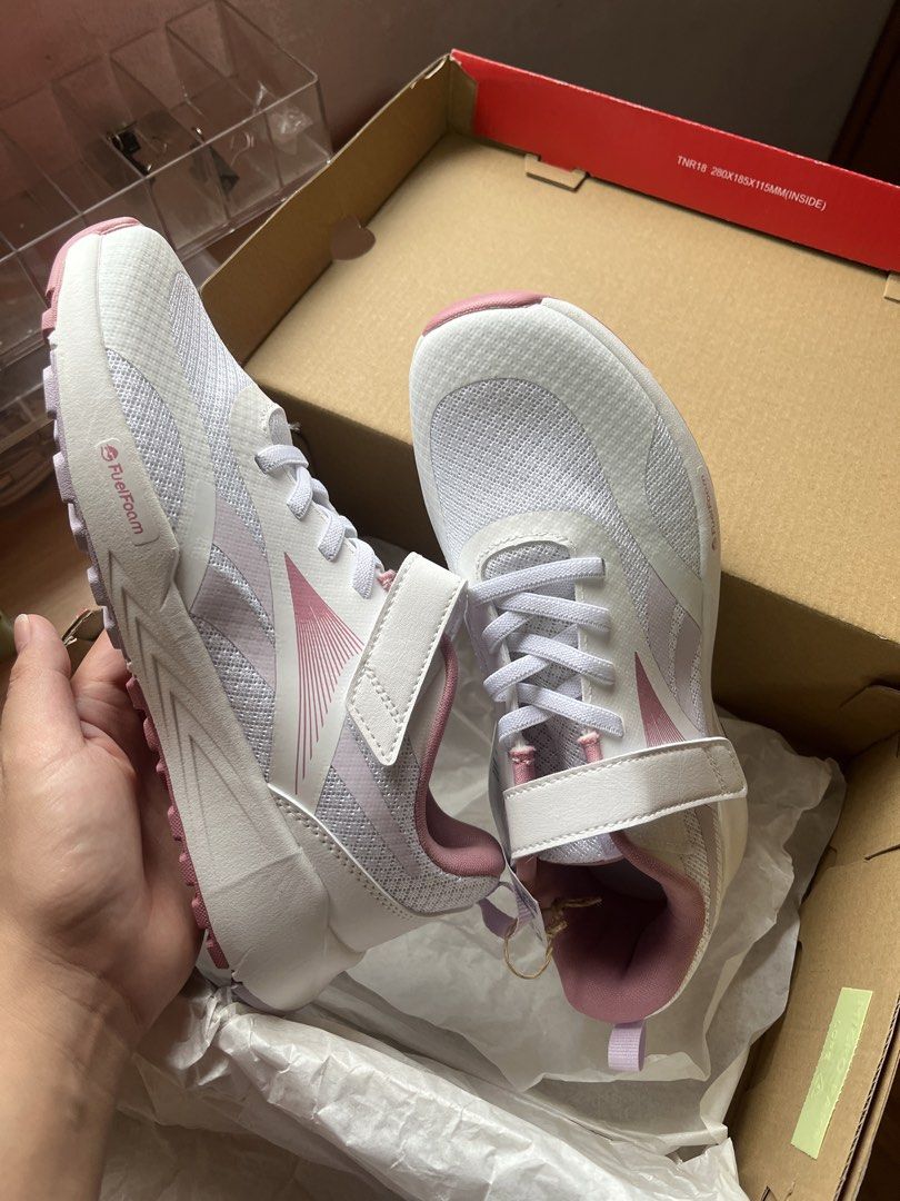 Reebok Kids Running Shoes (Category: Babies & Kids Fashion) located in Manila. Submitted by graceeeeee_ (Listing ID 1449192787, Image 2). Description: - Reebok running shoes for kids - Color: White with pink accents - Features: Elastic laces and top strap for easy on/off - Ideal for: Running and everyday wear - Condition: Comes in original box.